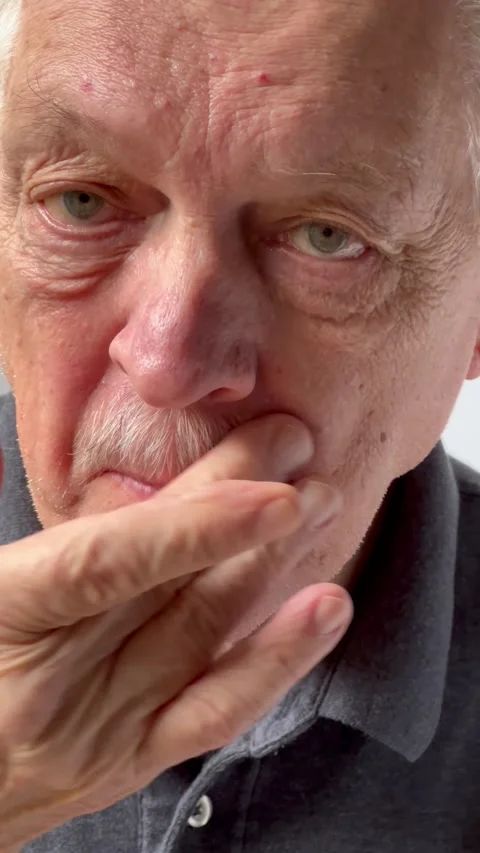 Man smooths down his mustache Stock Footage 220433810