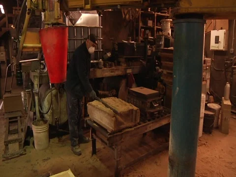Man Smooths Sand On Top Of Mold Stock Footage 1089647