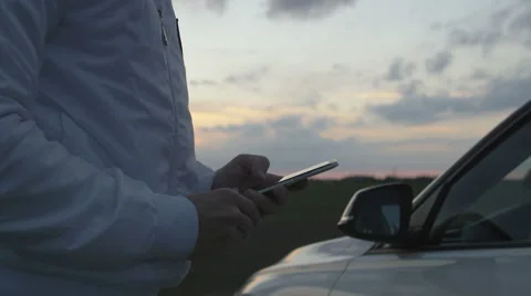 Man sms texting on smart phone Stock Footage 67876095