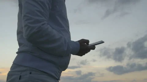 Man sms texting on smart phone Stock Footage 67876132