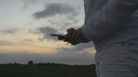 Man sms texting on smart phone Stock Footage 67876186