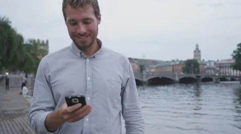 Man sms texting using app on smart phone at night - Urban man on smartphone Stock-Footage 50154324