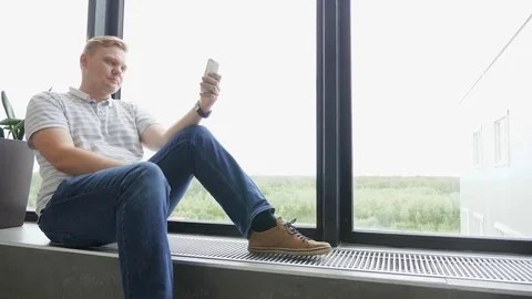 Man sms texting using app on smart phone at night in city. Handsome young Stock Footage 81467044