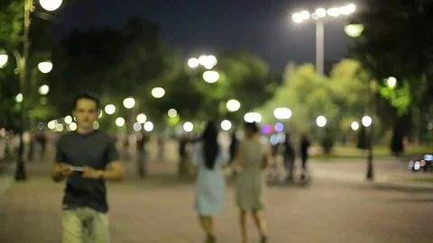 Man sms texting using app on smart phone at night in city.  Stock Footage 90771439