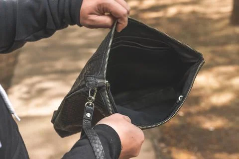 Man with snakeskin python handbag on nature background. Stockfoto's