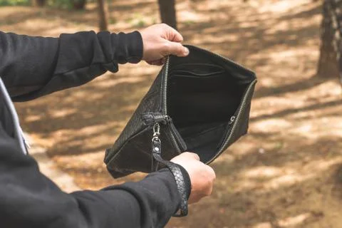 Man with snakeskin python handbag on nature background. 写真素材
