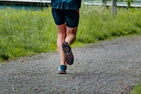 Man with sneakers running on a path, helathy activity to make exercice Foto stock