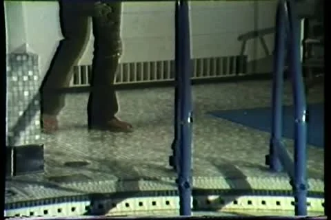 Man sneaking python into swimming pool 動画素材 11354337