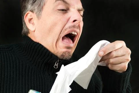 Man sneezes Stock Photos