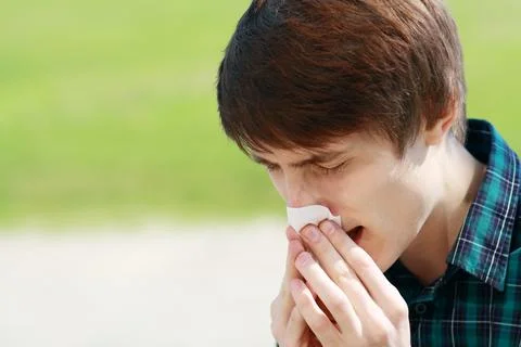 Man sneezing Stock Photos