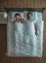 The man snore near the woman on the bed. view from above Photo