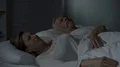 Man snoring in bed, woman beside him pressing hands against ears, troubled sleep 4k or 4k+ Resolution