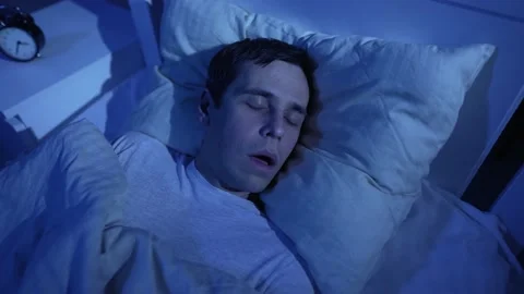 Man snoring while deep sleep in bed Stock-Footage 165345469
