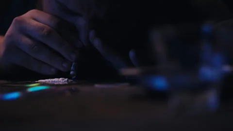 Man snorting cocaine from a cd Video stock 275104360