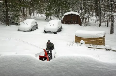 Man with snow blower Stock Photos