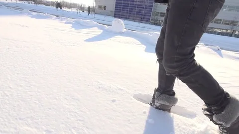 Man in Snow Boots Walks Through Deep Powder Snow Video stock 80072456