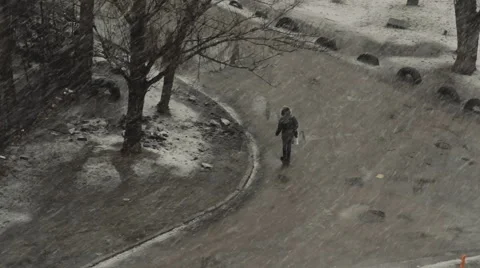 The Man in the Snow in the City Stock Footage 60703905