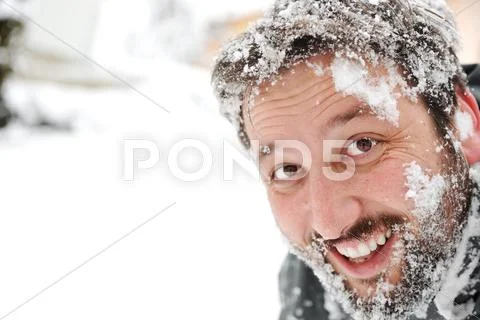 Man in snow, face closeup fun Stock-Fotos