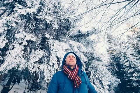Man in snow forest Stock Photos