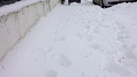 Man with snow shovel cleans sidewalks in winter Stock-Footage 101075051