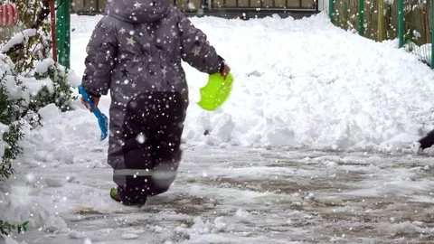 Man with snow shovel cleans sidewalks in winter Stock Footage 101302131