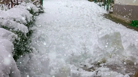 Man with snow shovel cleans sidewalks in winter Stock Footage 101302341