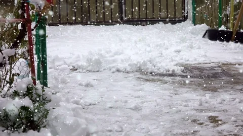 Man with snow shovel cleans sidewalks in winter Видео 101302983