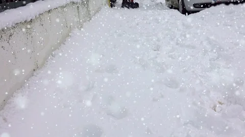 Man with snow shovel cleans sidewalks in winter Stock Footage 101303241