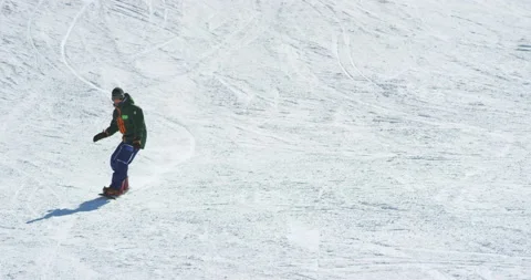 Man Snowboarding During Winter Holidays Stock Footage 139399384