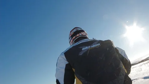 Man on a snowmobile Stock Footage 99925946