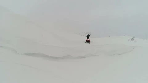 Man on a snowmobile jumps off the mountain Stock-Footage 102211953