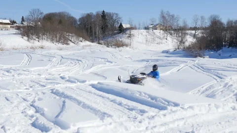 Man on snowmobile in winter mountain Stock Footage 87894918