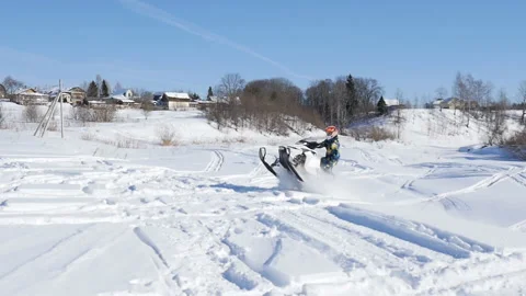 Man on snowmobile in winter mountain Stock Footage 87894981