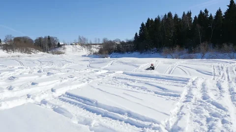 Man on snowmobile in winter mountain Stock Footage 87895042