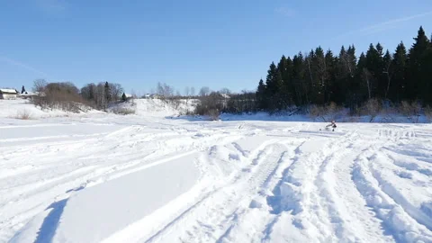 Man on snowmobile in winter mountain Stock Footage 87895127