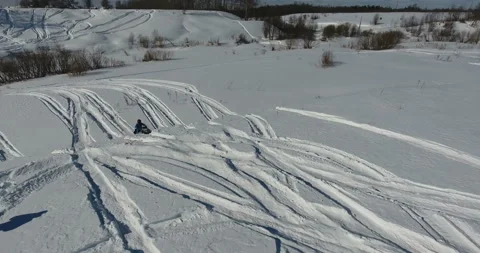 Man on snowmobile in winter mountain Stock Footage 87939537