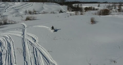 Man on snowmobile in winter mountain Stock Footage 87942582