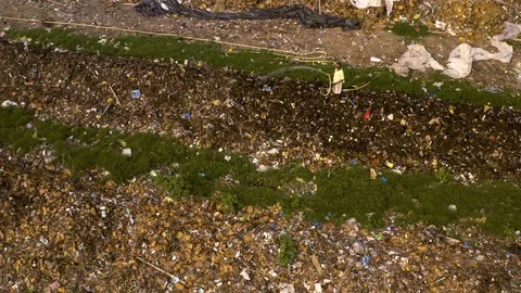Man soaks garbage for recycling in India 4k drone aerial Video stock 109306741