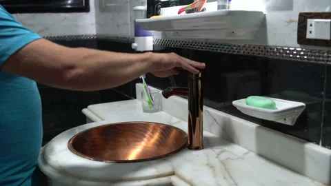 Man soaping his hands with soap and washing his hands in the sink in the Stock Footage 101501035