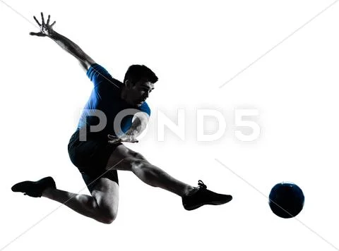 Man soccer football player flying kicking silhouette Stock Photos