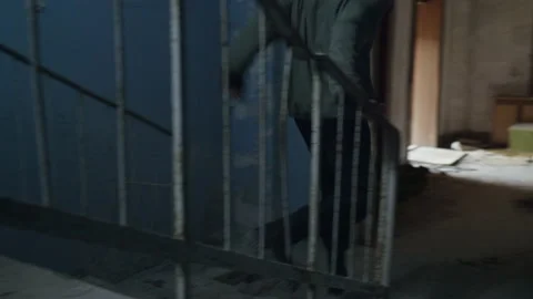 Man with social issues, runs inside a big wrecked empty building 库存影片 227925459