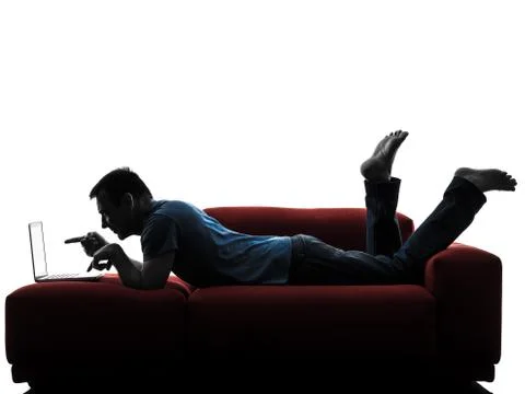 Man sofa couch computer computing laptop pointing Stock Photos