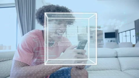 Man on sofa with phone tapping, viewing data, causing 3D cube over hands, Stock Footage 333894287