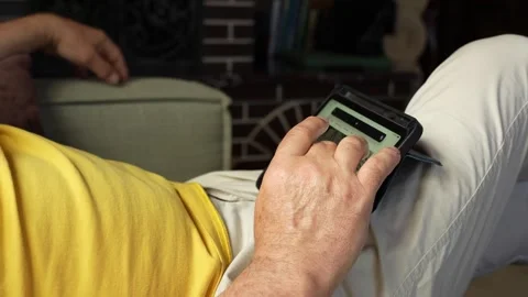 Man on the sofa scrolls the news feed on the website Stock Footage 276282149