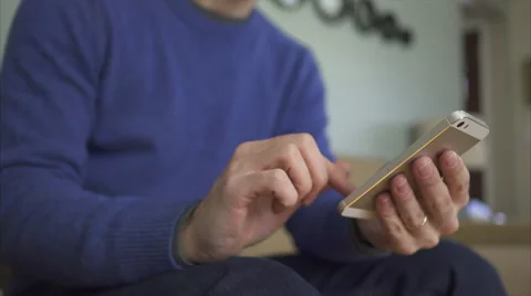 A Man on a Sofa Using The Latest Technology in 4K (5 of 9) Stock Footage 47314083