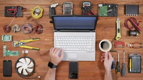 Man software engineer working at a desk with a laptop and a cup of coffee Stock Footage 72415091