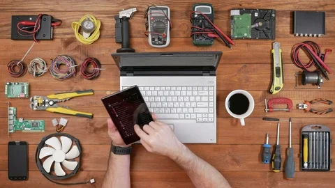 Man software engineer working for your tablet and drinking coffee. Wooden table Stock Footage 72416435