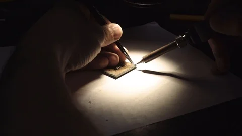 Man soldering a computer processor Stock Footage 95998205