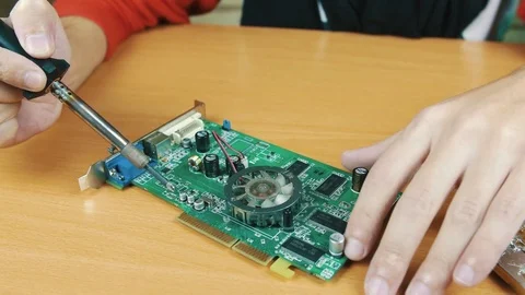 The man solders a chip Stock Footage 70597238