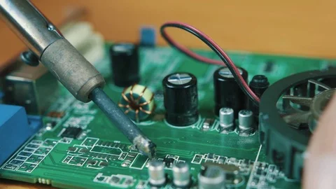 The man solders a chip Stock Footage 70599460